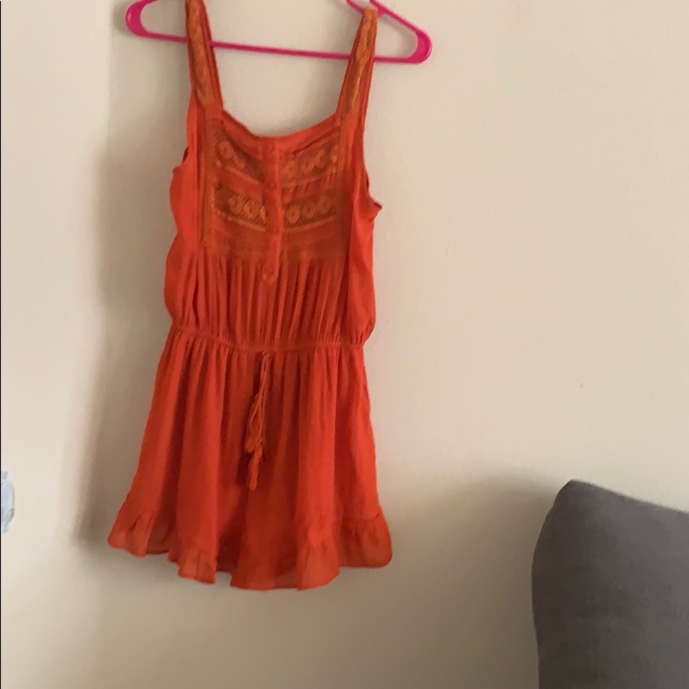 Boutique orange romper, embroidery details